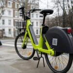 Lime e-bike parked on a London pavement near a pedestrian crossing